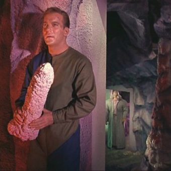 Captain Kirk grabs the phallic cave rock