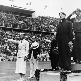 1936: Jess Owens accepts his Olympic 100m Gold medal