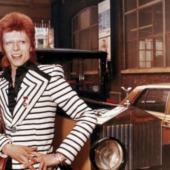 David Bowie Poses Beside His Rolls Royce In 1973