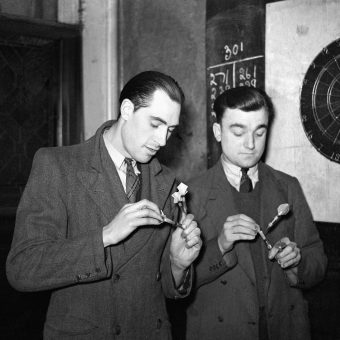 Two Men Play Darts For A Pint Of Beer In A 1930 London Pub